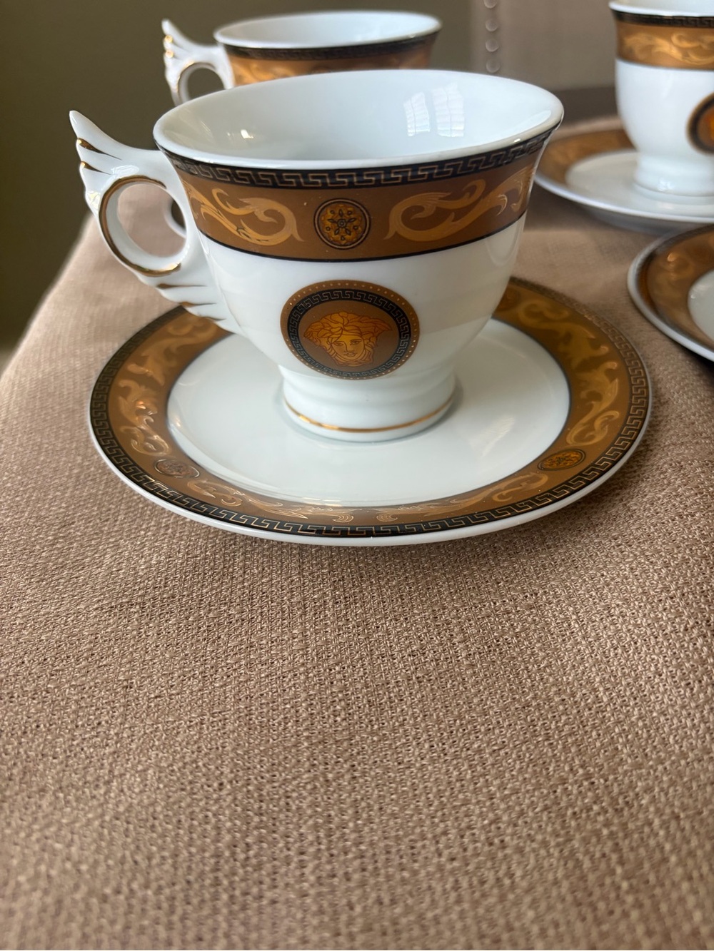 VERSAGE Gold and White Porcelain Tea Cup & Saucer - Classic Medallion Design